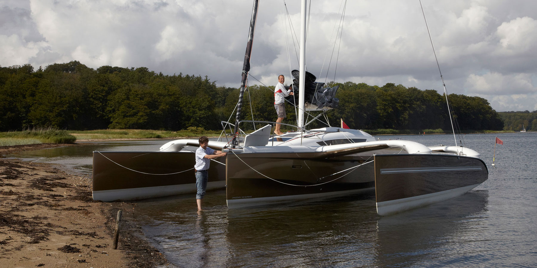 Dragonfly 32 trimaran floats in knee-deep water