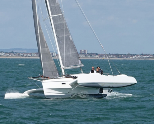 Dragonfly 28 trimaran approaching the finish of RORC Race the Wight