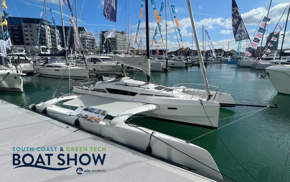 Bows extend beyond centre hull Dragonfly 28 at South Coast Boat Show