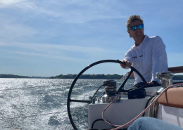 Toby Hodges of Yachting World, helming DF 36 at speed
